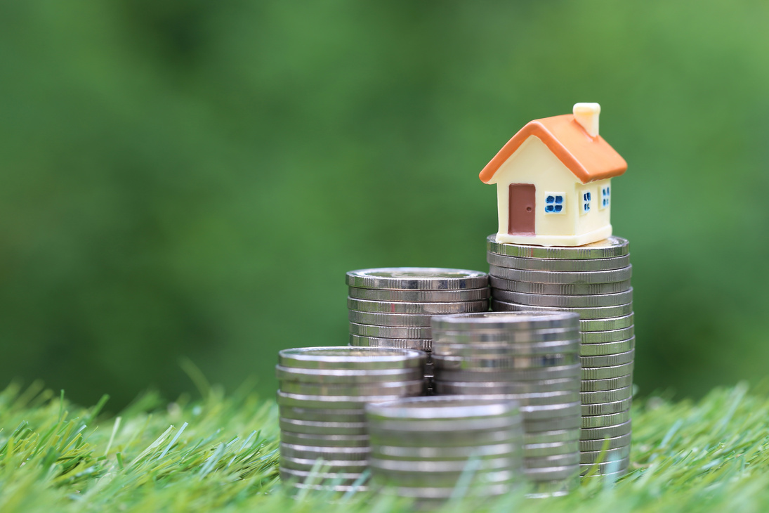 Stack of Coins with a Miniature House